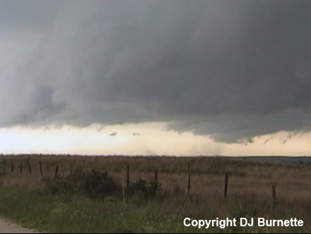 Downburst under Decaying Wall Cloud